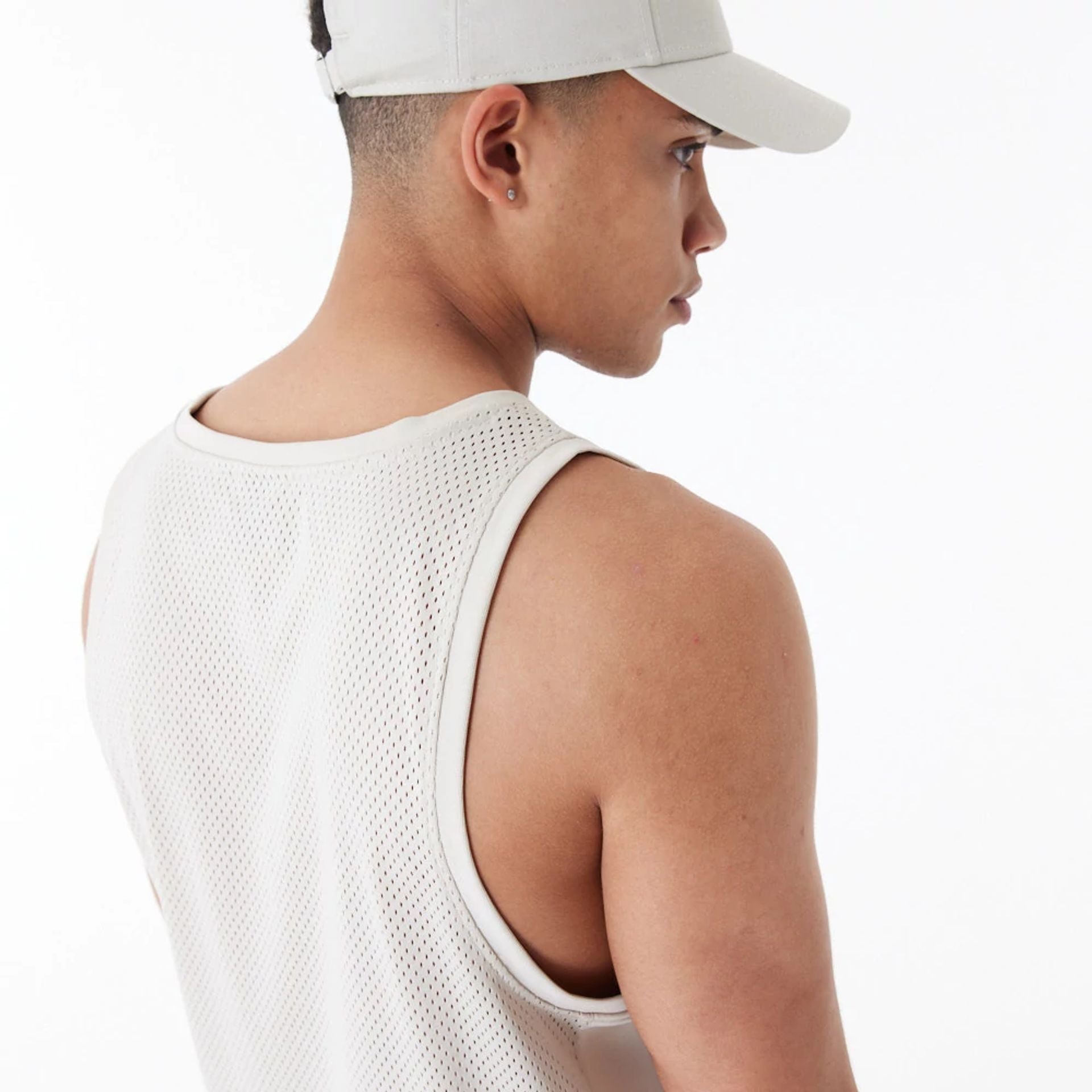 The Male model is wearing New Era Arch Logo Stone Mesh Tank Top 5