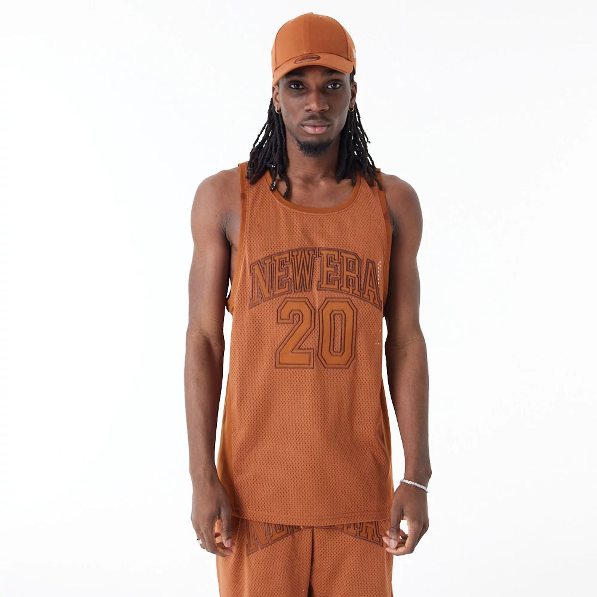 The Male model is wearing New Era Arch Logo Brown Mesh Tank Top 1