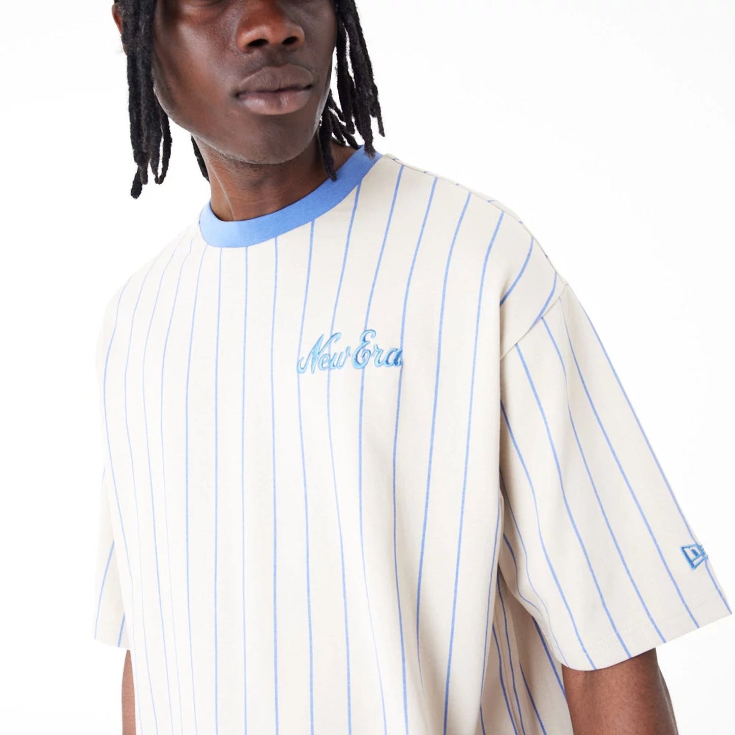 The Male model is wearing New Era Pinstripe Stone Oversized T-Shirt 2