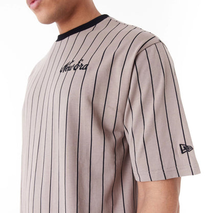 The Male model is wearing New Era Pinstripe Brown Oversized T-Shirt 7