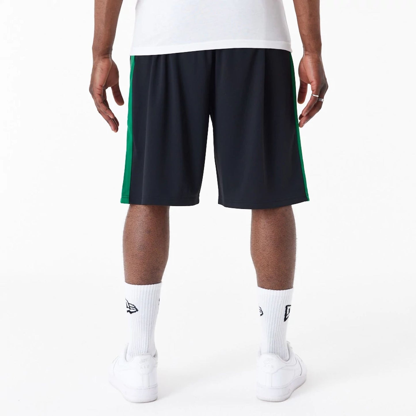 The Male model is wearing New Era Dark Green Panel Black Shorts 2