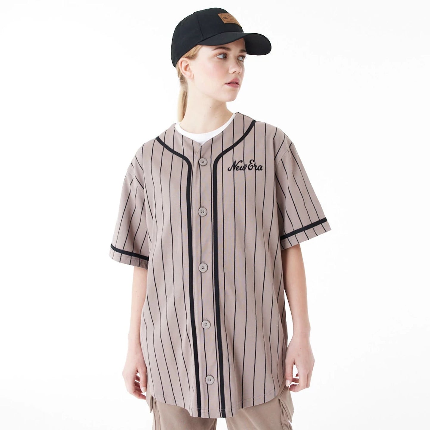 The Male model is wearing New Era Pinstripe Brown Jersey 7