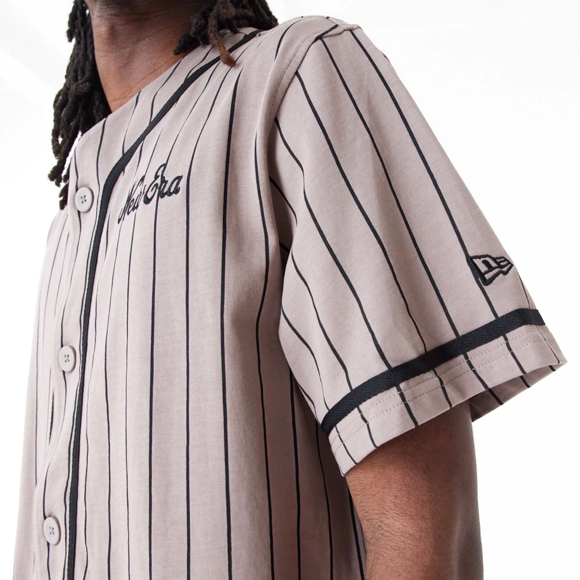 The Male model is wearing New Era Pinstripe Brown Jersey 4