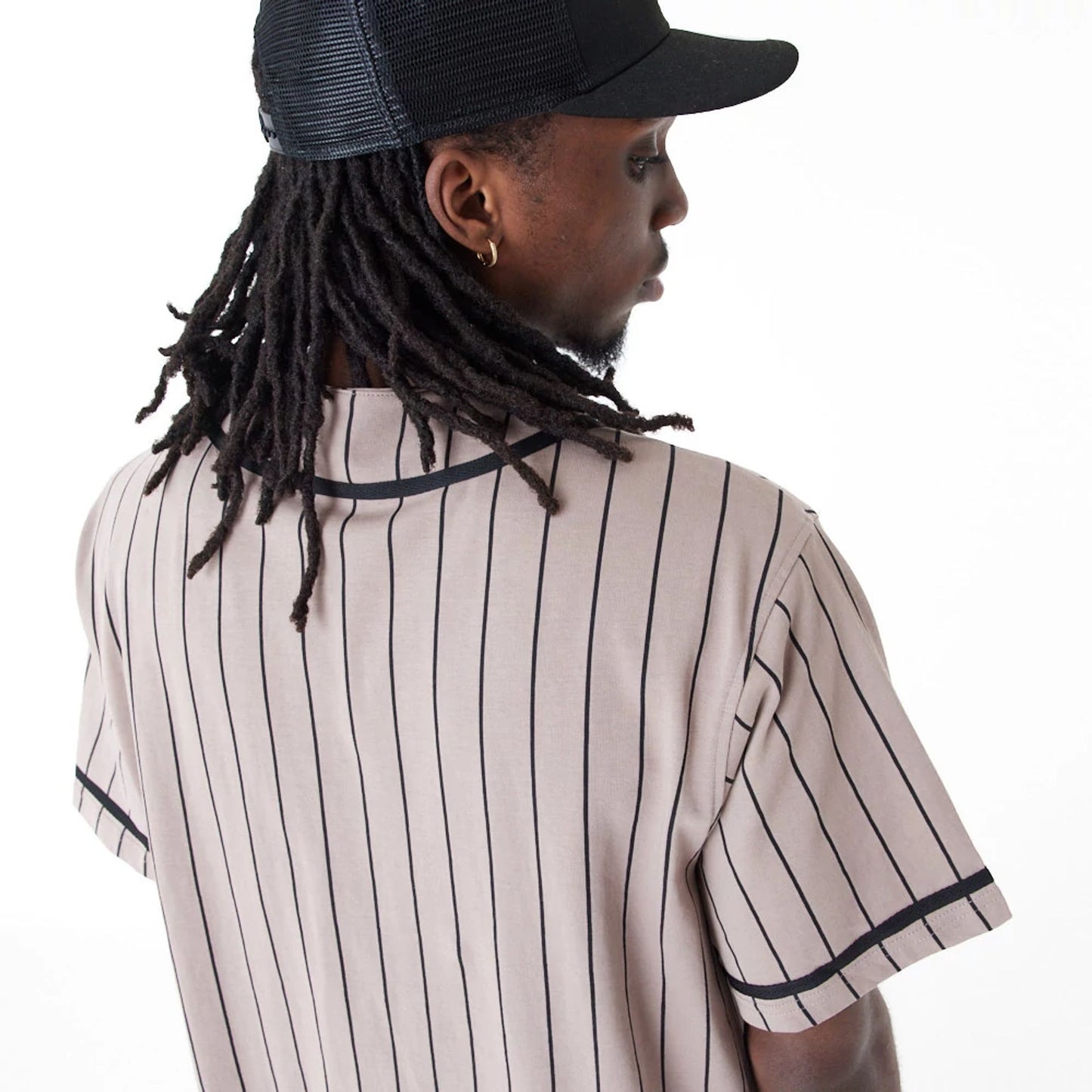 The Male model is wearing New Era Pinstripe Brown Jersey 6