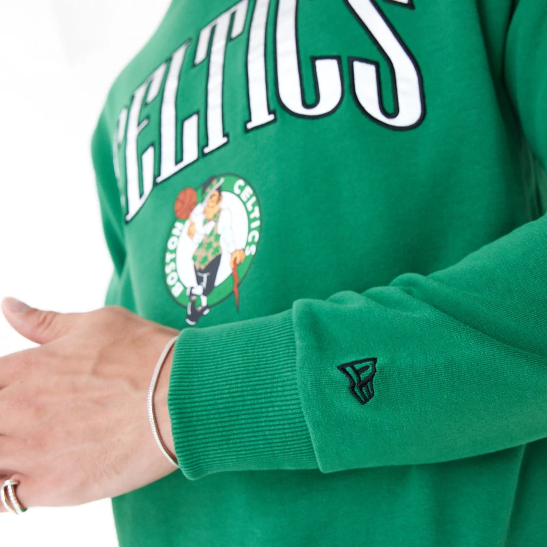 The Male model is wearing Boston Celtics NBA Arch Graphic Green Oversized Crew Neck Sweatshirt 4