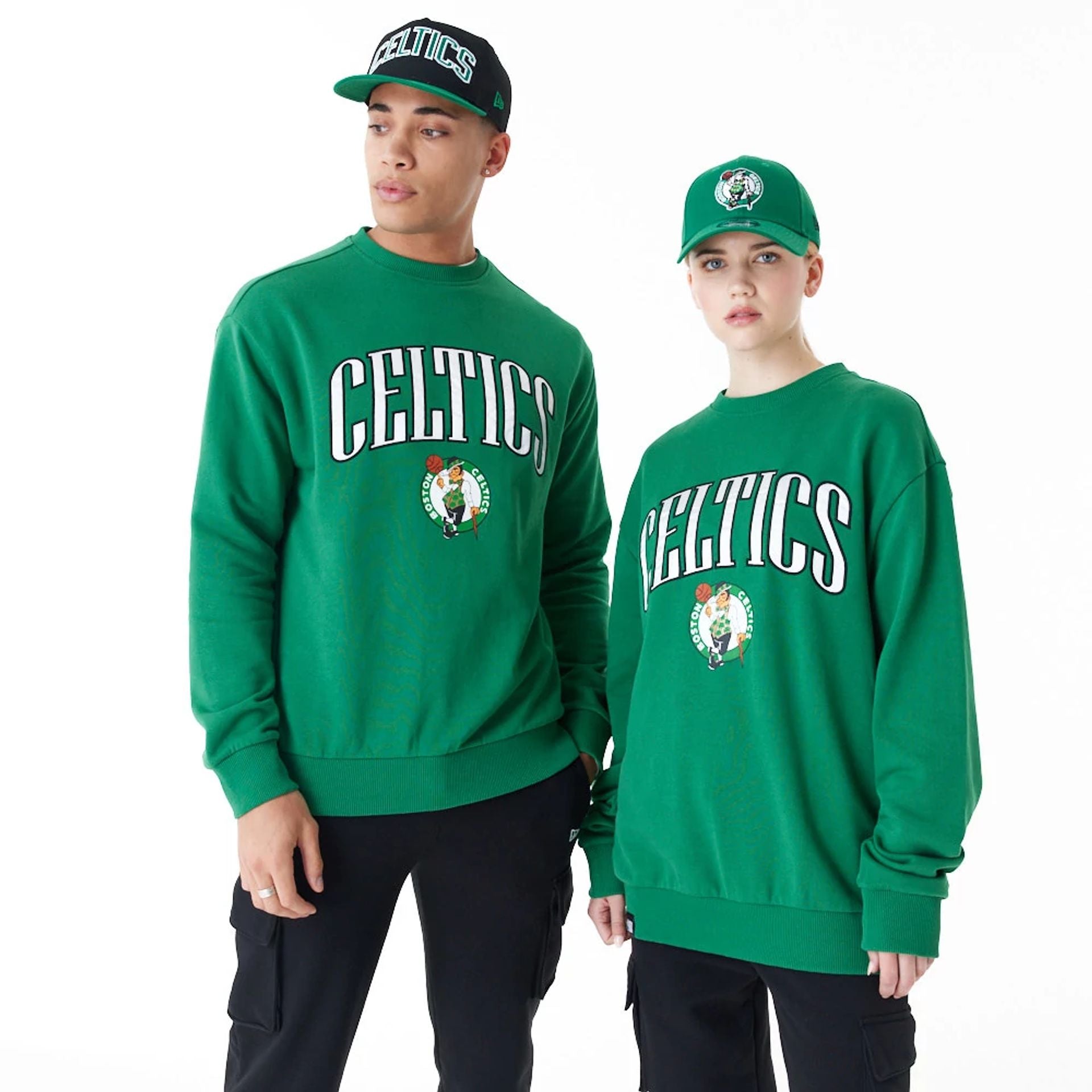 The Male model is wearing Boston Celtics NBA Arch Graphic Green Oversized Crew Neck Sweatshirt 1