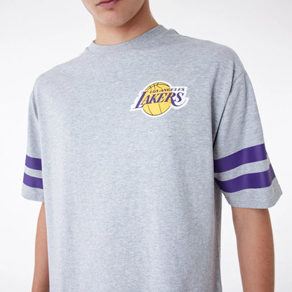 The Male model is wearing LA Lakers NBA Arch Graphic Grey Oversized T-Shirt 3