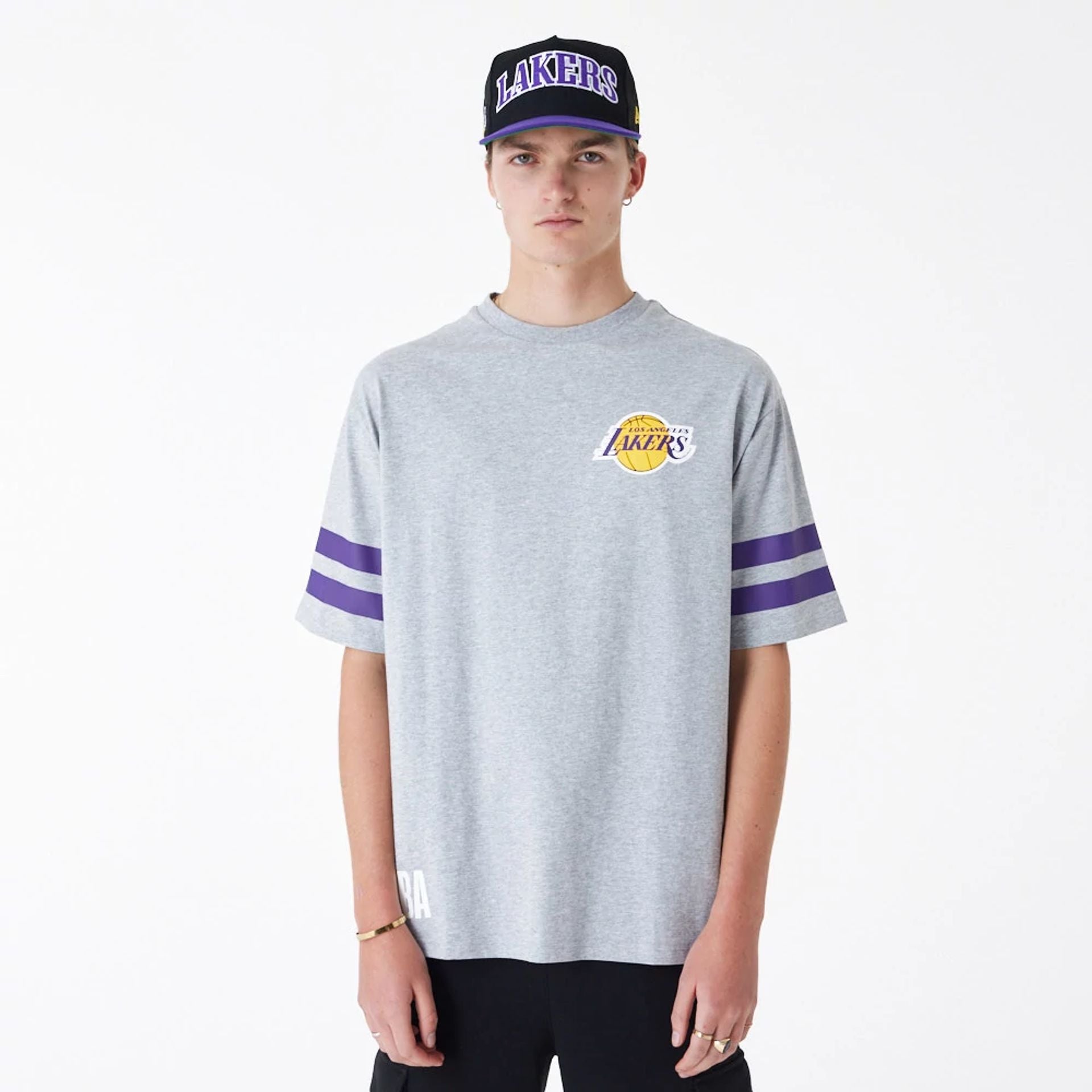 The Male model is wearing LA Lakers NBA Arch Graphic Grey Oversized T-Shirt 1