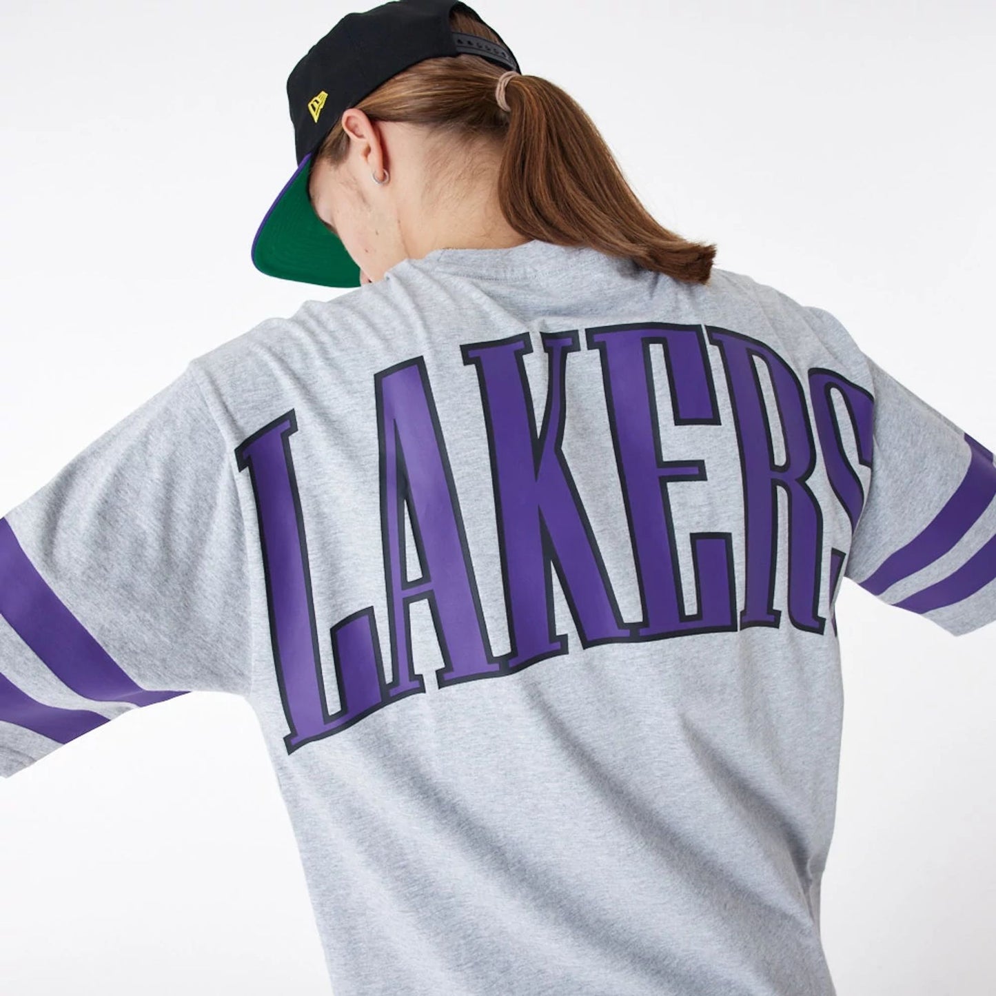 The Male model is wearing LA Lakers NBA Arch Graphic Grey Oversized T-Shirt 6