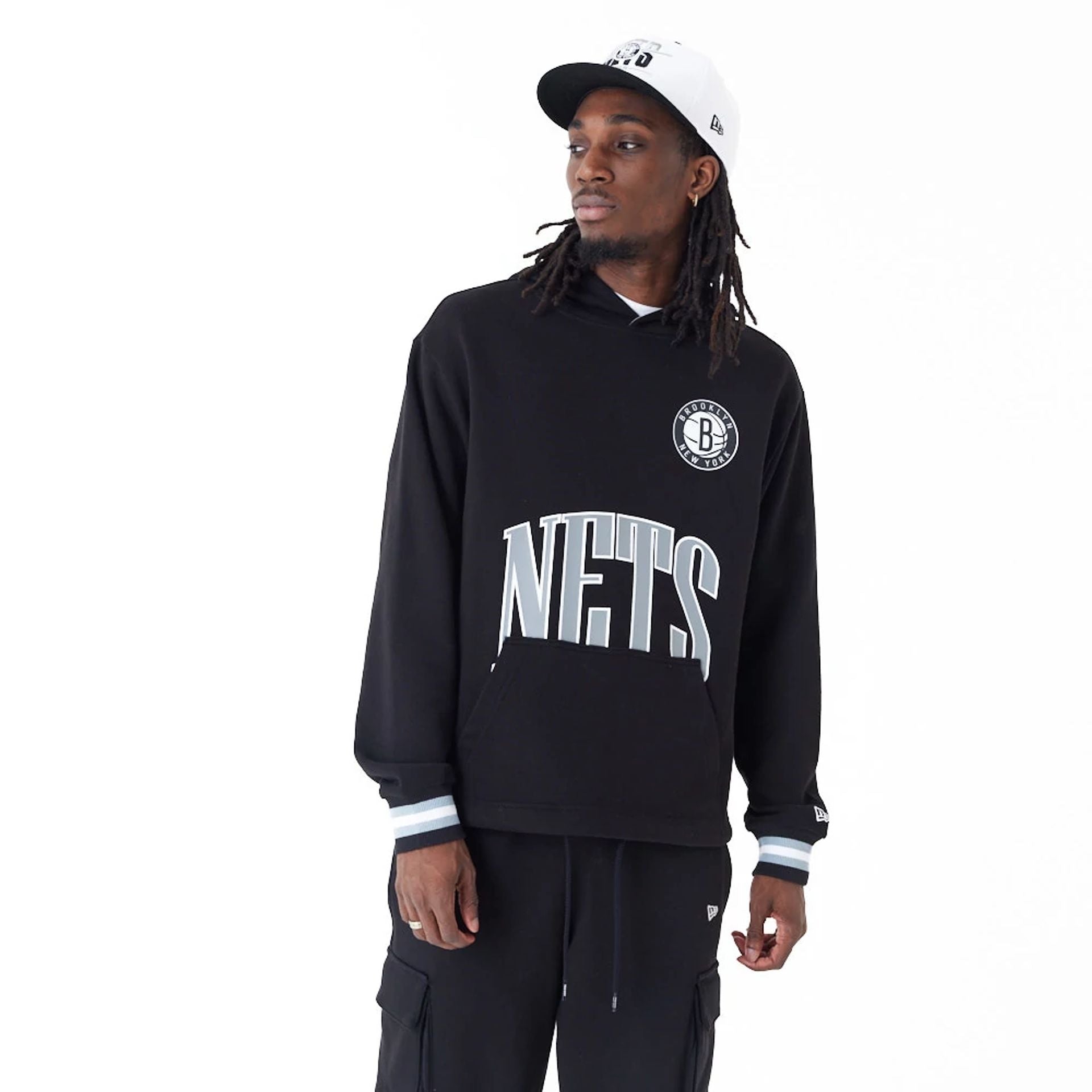 The Male model is wearing Brooklyn Nets NBA Arch Graphic Black Oversized Pullover Hoodie 1