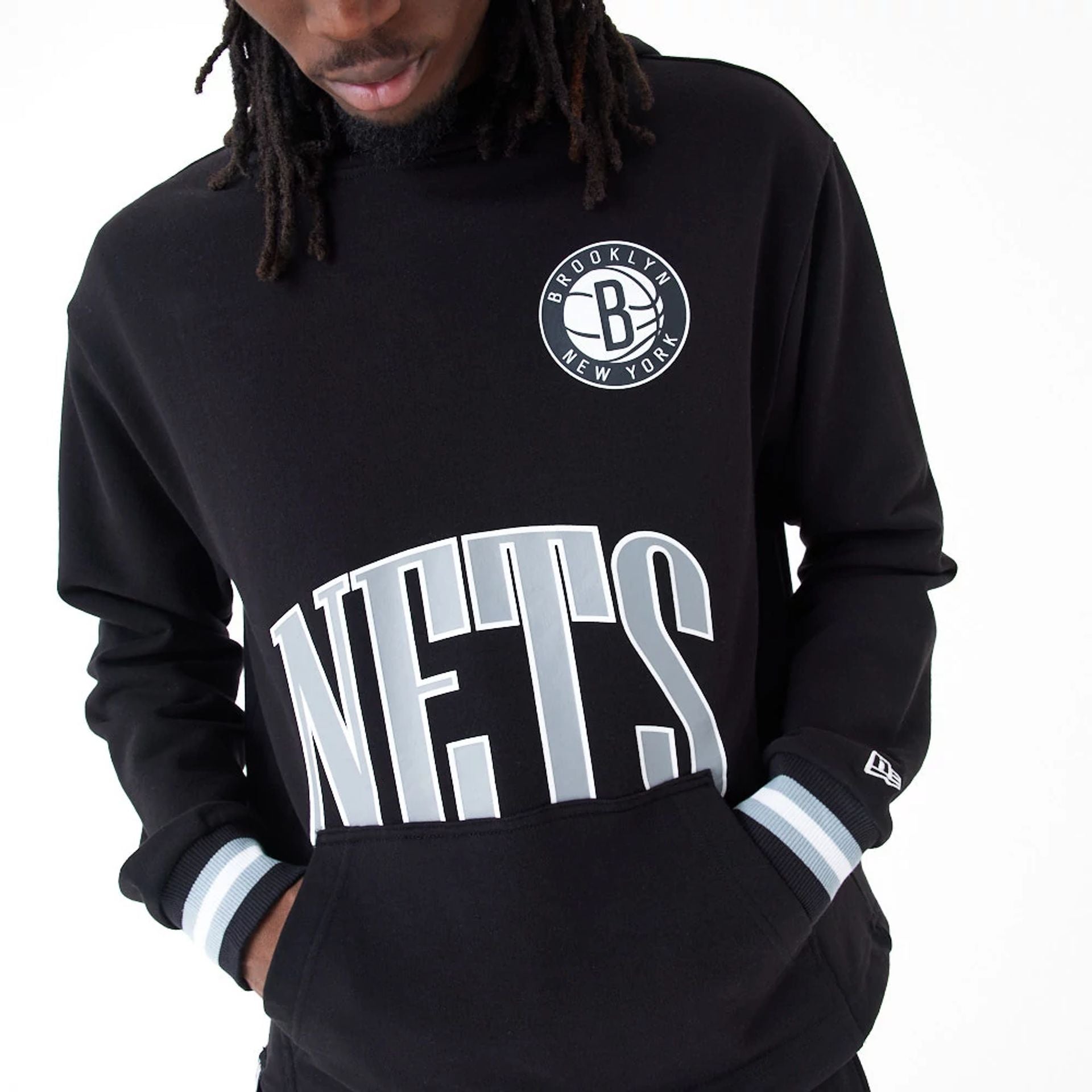 The Male model is wearing Brooklyn Nets NBA Arch Graphic Black Oversized Pullover Hoodie 2