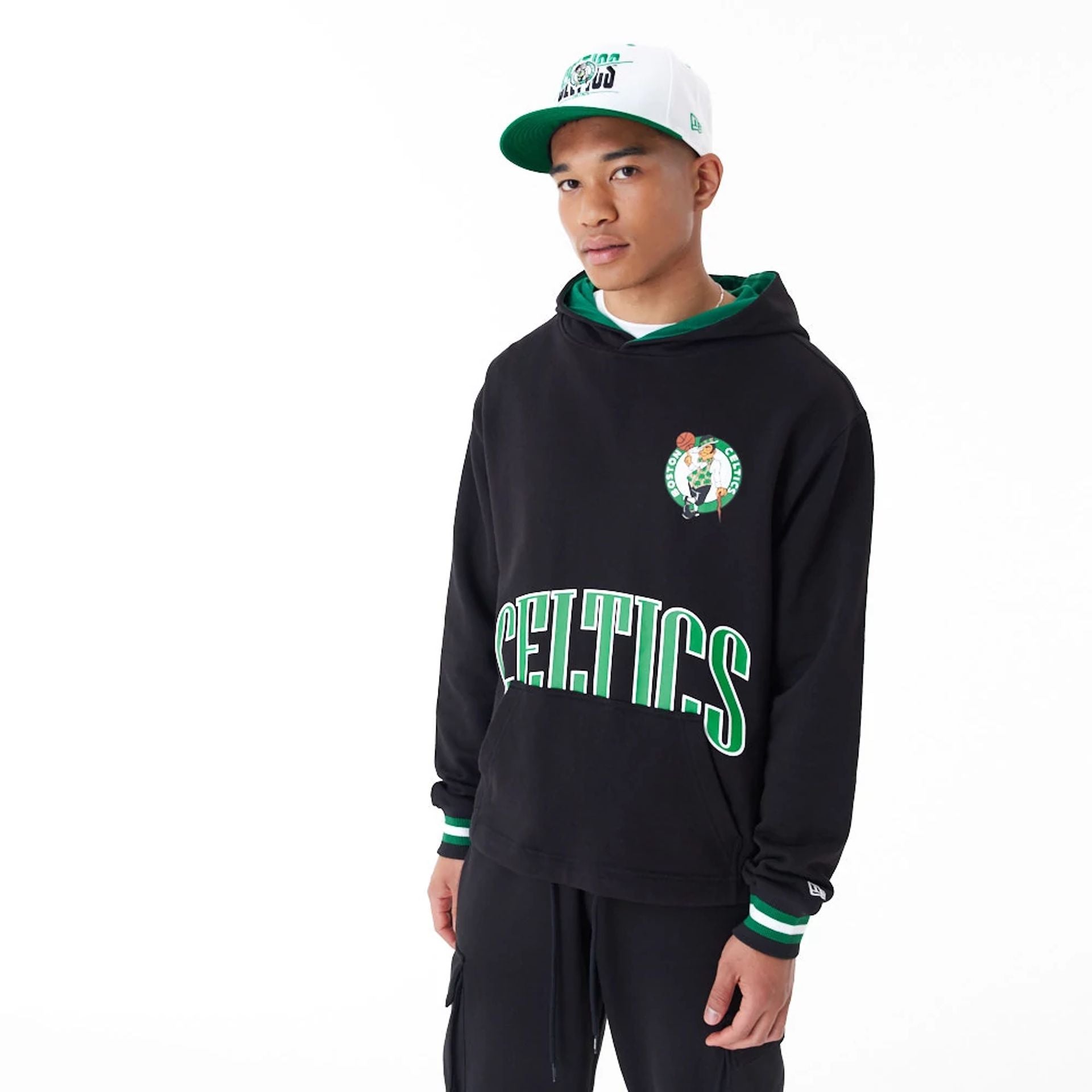 The Male model is wearing Boston Celtics NBA Arch Graphic Black Oversized Pullover Hoodie 1