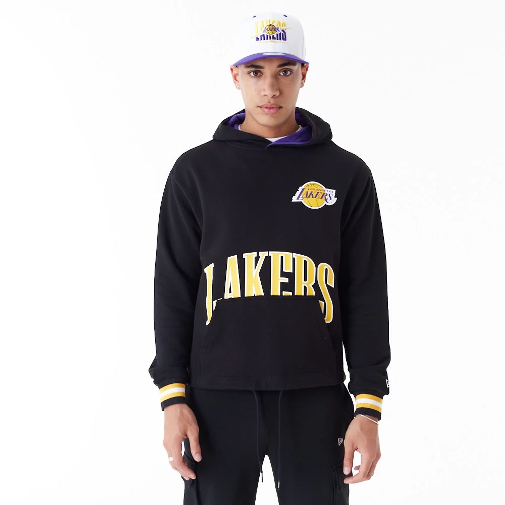 The Male model is wearing LA Lakers NBA Arch Graphic Black Oversized Pullover Hoodie 1