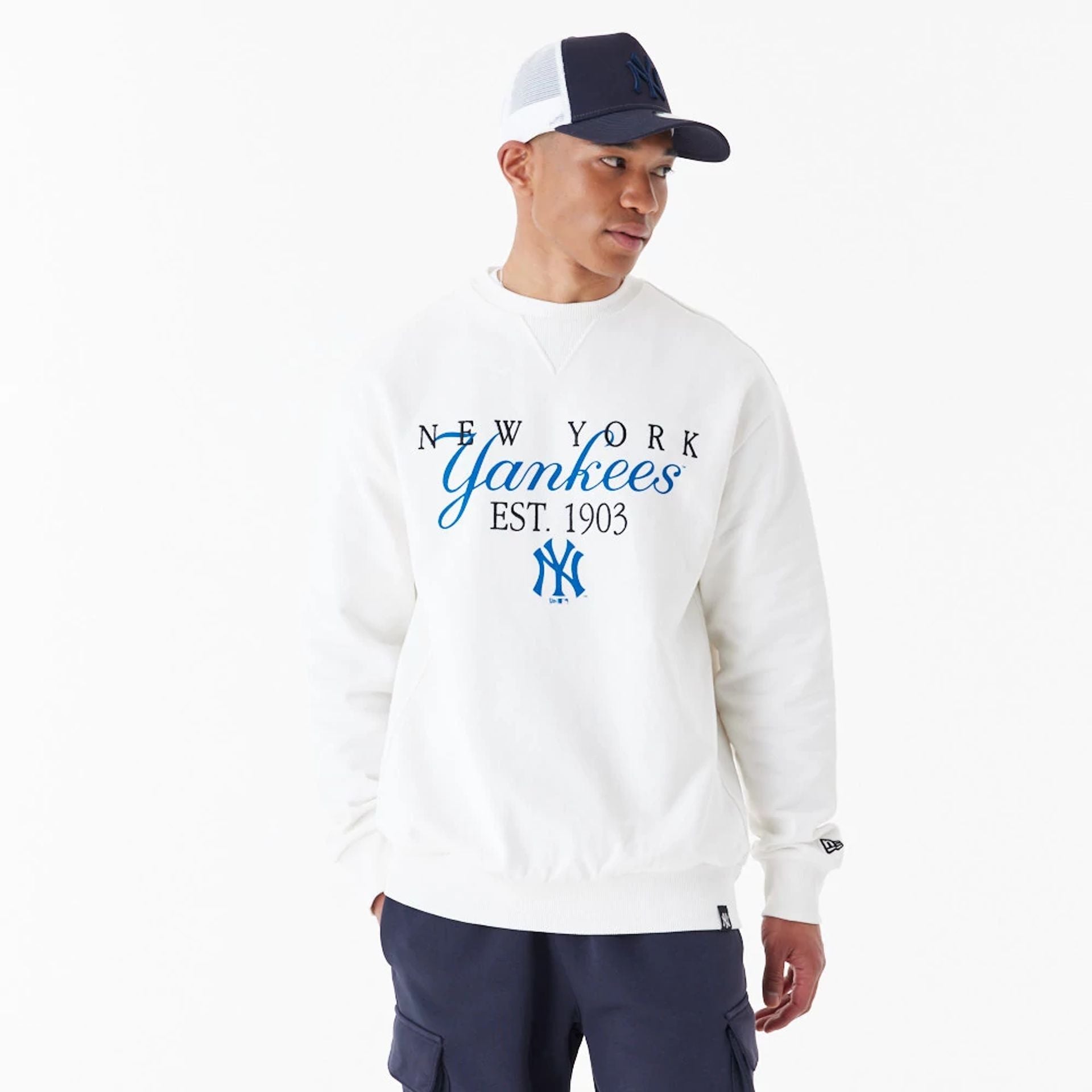 The Male model is wearing New York Yankees MLB Lifestyle Off White Crew Neck Sweatshirt 1