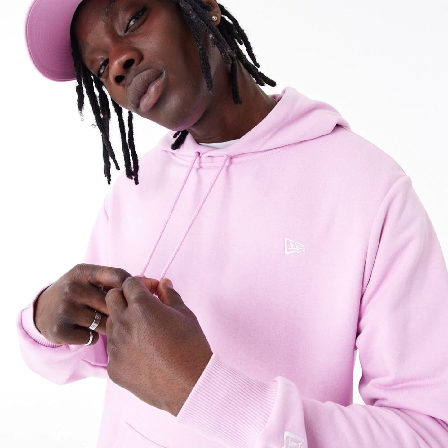 The Male model is wearing New Era Essential Pink Pullover Hoodie 9