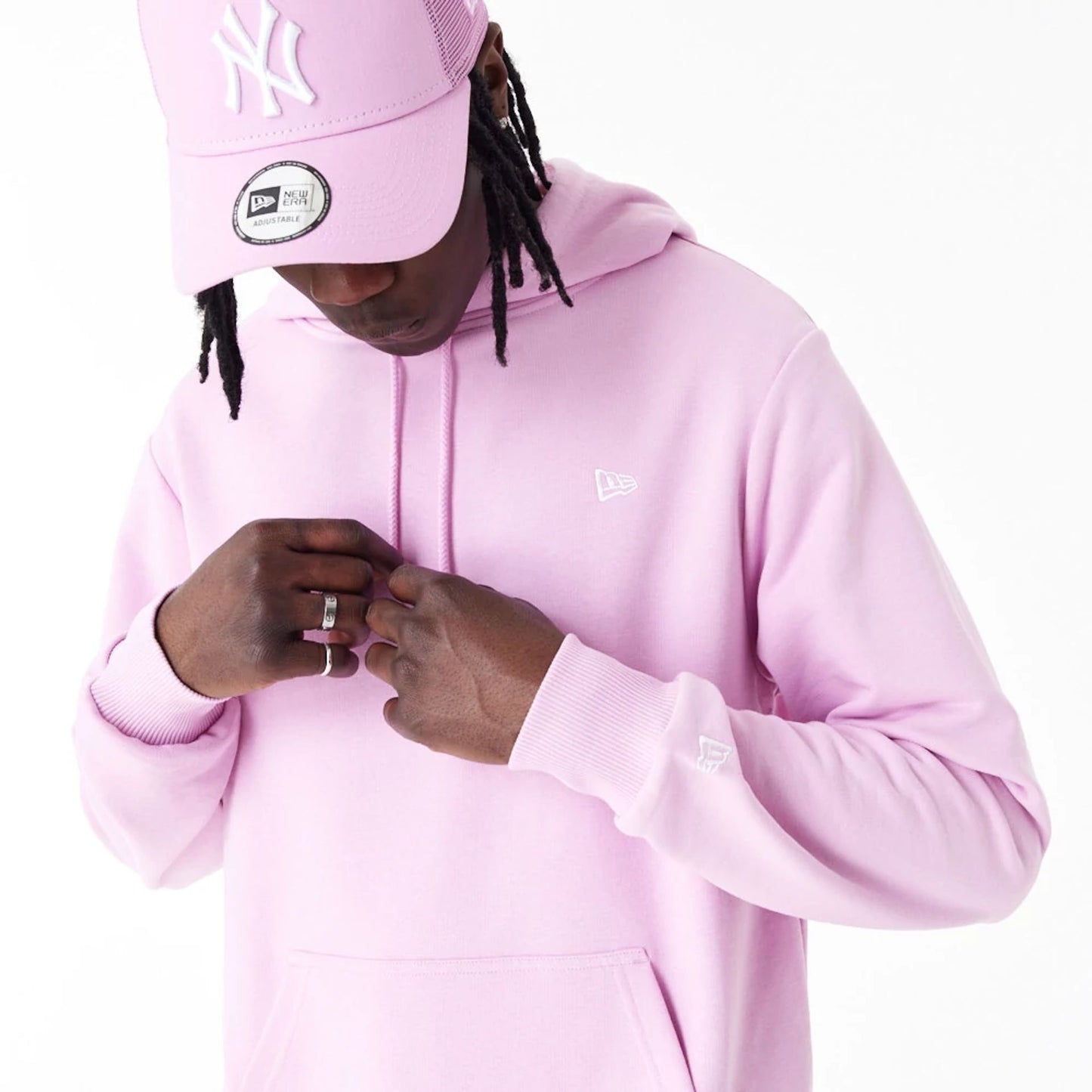 The Male model is wearing New Era Essential Pink Pullover Hoodie 10