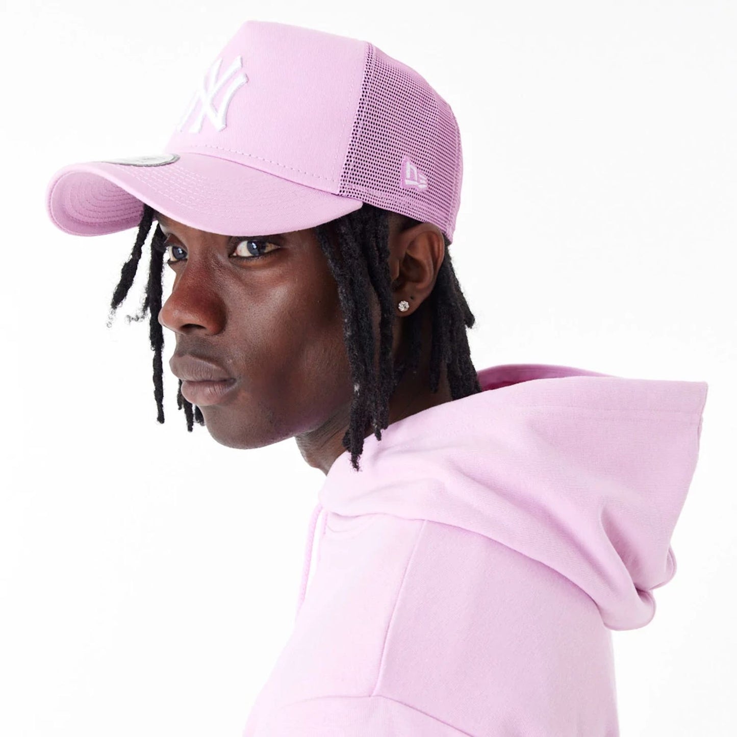 The Male model is wearing New Era Essential Pink Pullover Hoodie 7