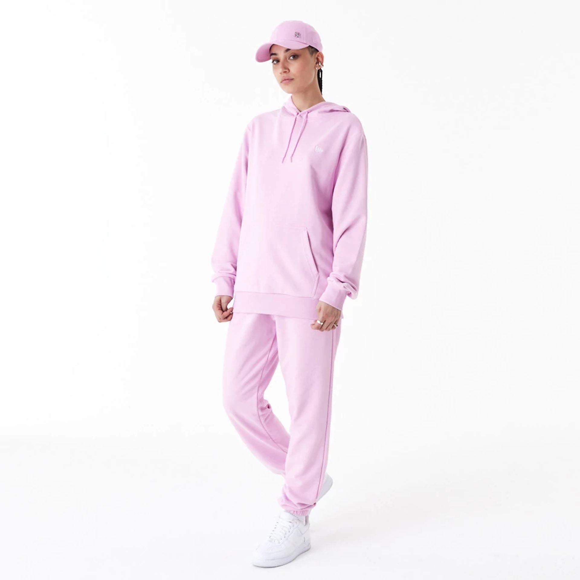 The Male model is wearing New Era Essential Pink Pullover Hoodie 6