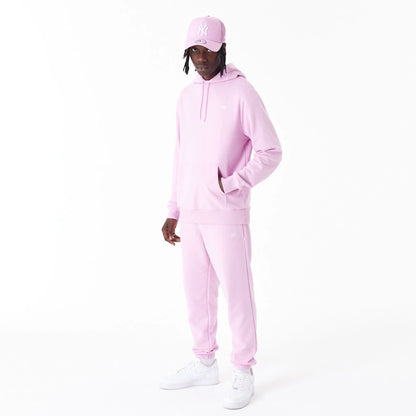 The Male model is wearing New Era Essential Pink Pullover Hoodie 3