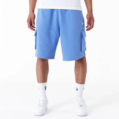 The Male model is wearing New Era Essential Blue Cargo Shorts 1