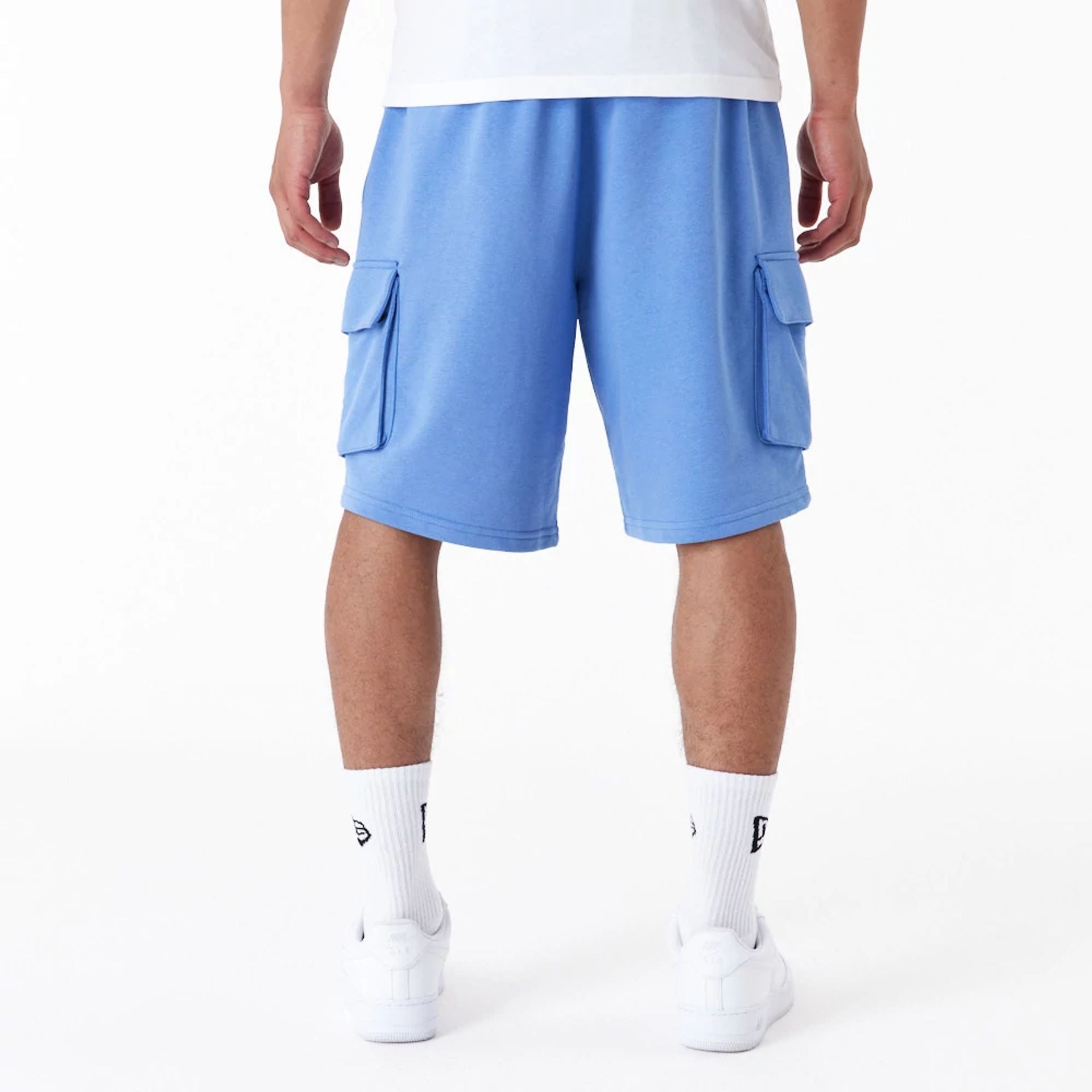 The Male model is wearing New Era Essential Blue Cargo Shorts 8