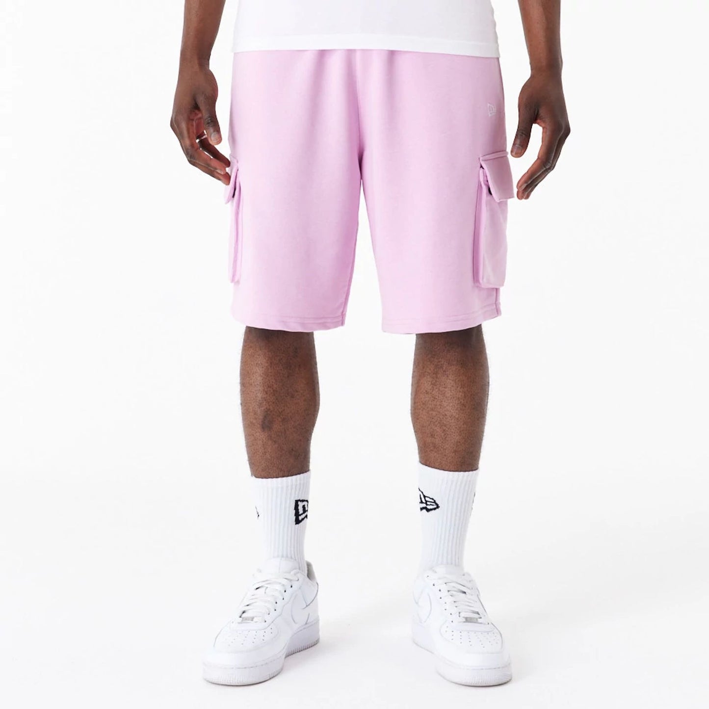 The Male model is wearing New Era Essential Pink Cargo Shorts 1