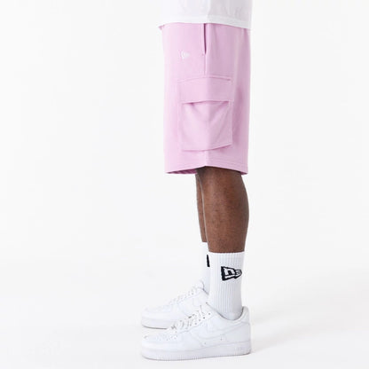 The Male model is wearing New Era Essential Pink Cargo Shorts 6