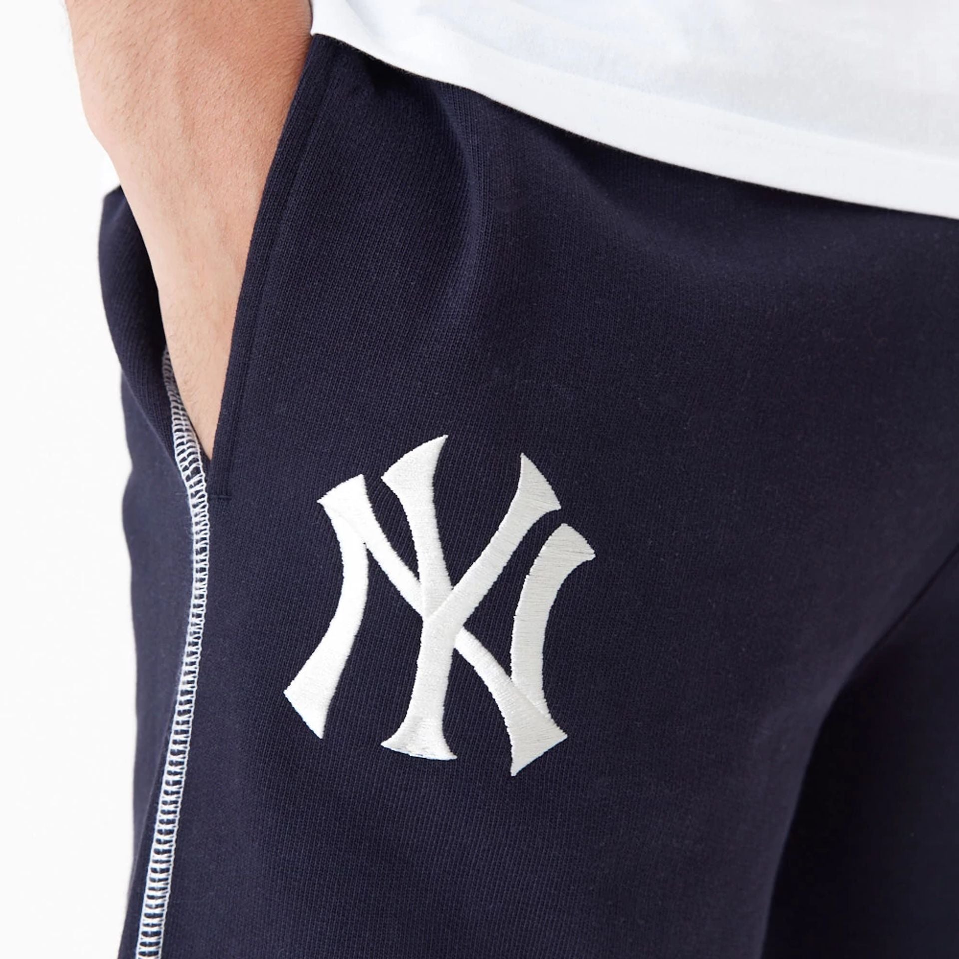 The Male model is wearing New York Yankees MLB Lifestyle Navy Joggers 4