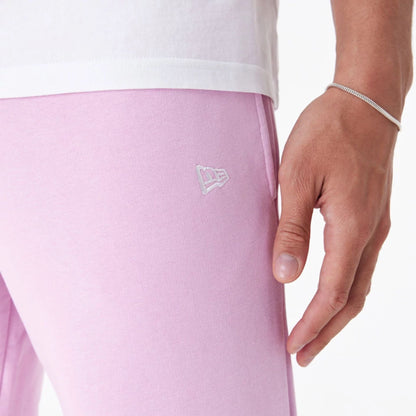 The Male model is wearing New Era Essential Pink Slim Joggers 5