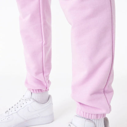 The Male model is wearing New Era Essential Pink Slim Joggers 6