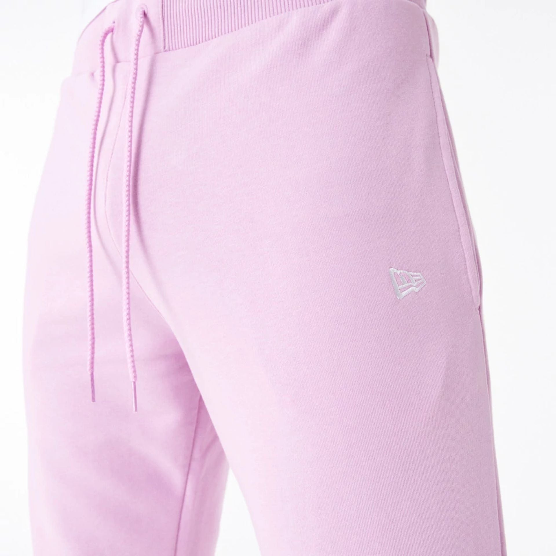 The Male model is wearing New Era Essential Pink Slim Joggers 4