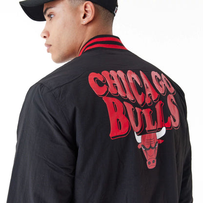 The Male model is wearing Chicago Bulls NBA Script Logo Black Bomber Jacket 4