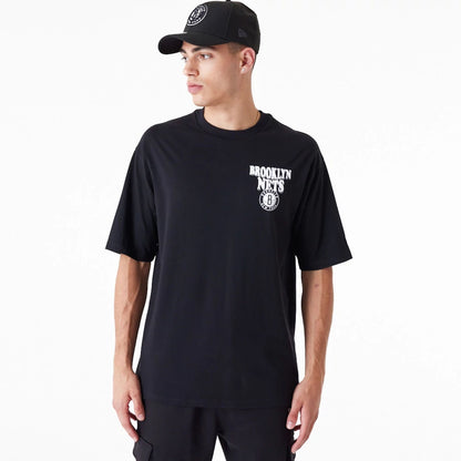 The Male model is wearing Brooklyn Nets NBA Script Black Oversized T-Shirt 1