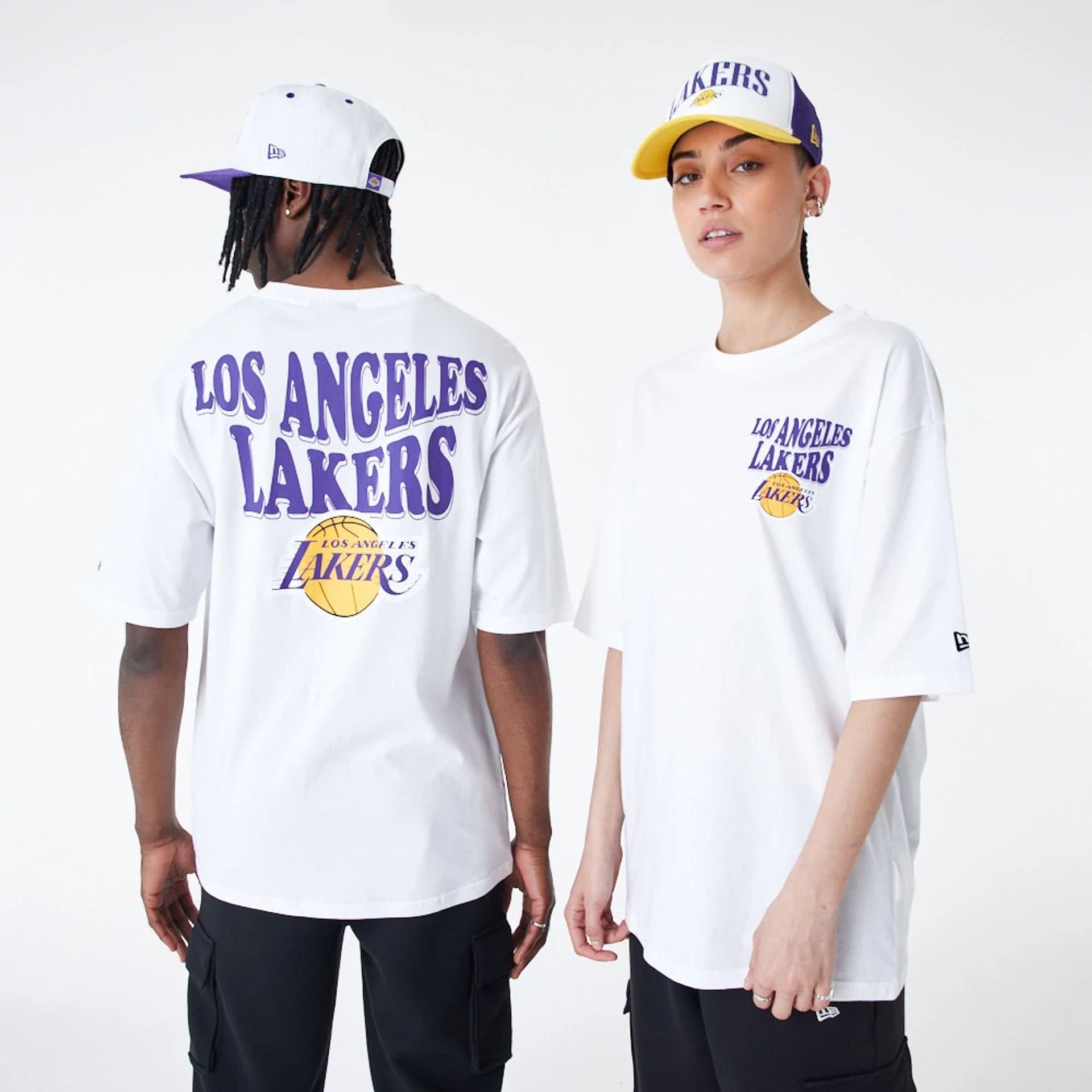 The Male model is wearing LA Lakers NBA Script White Oversized T-Shirt 1