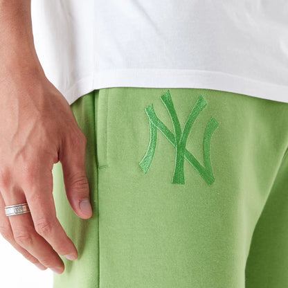 The Male model is wearing New York Yankees League Essential Green Joggers 5