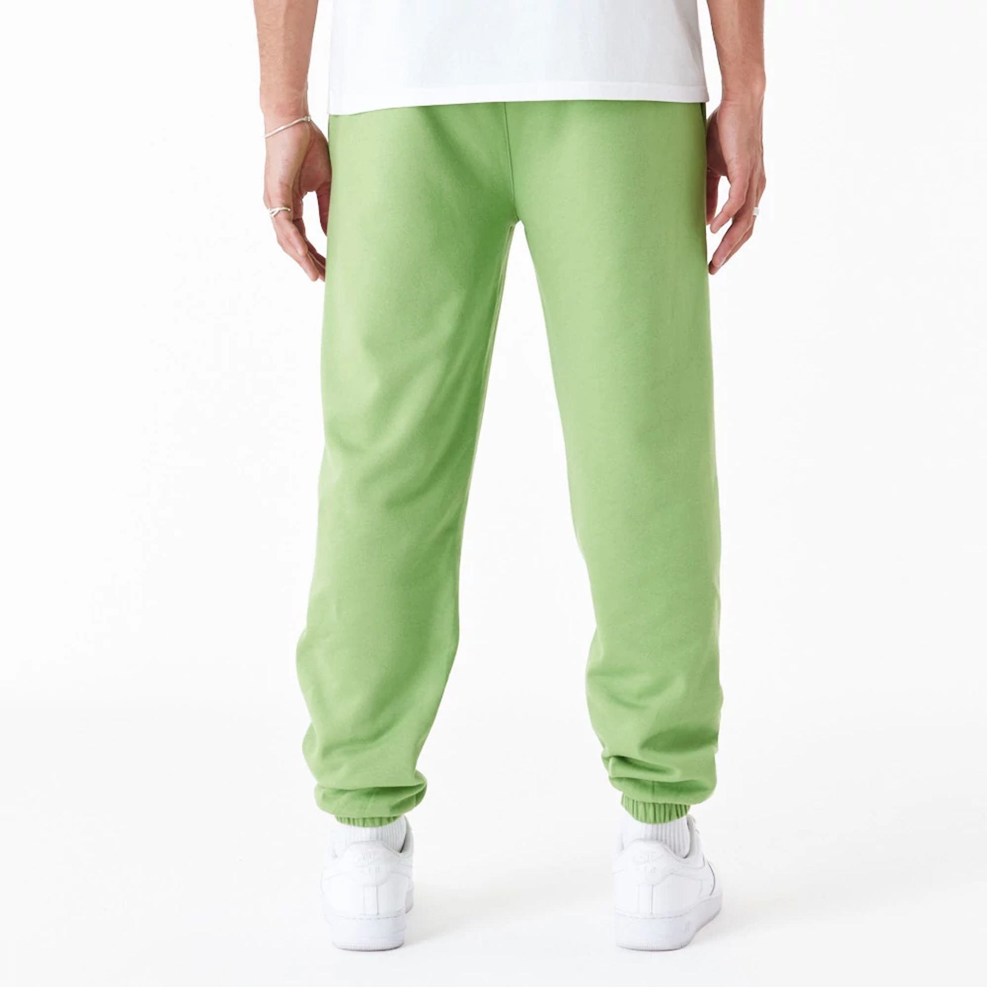 The Male model is wearing New York Yankees League Essential Green Joggers 4