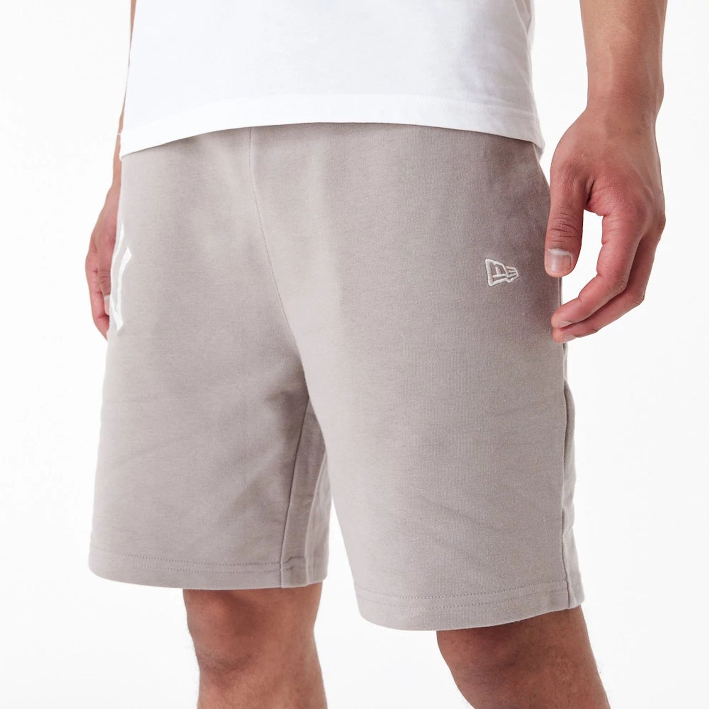 The Male model is wearing New York Yankees League Essential Beige Shorts 6