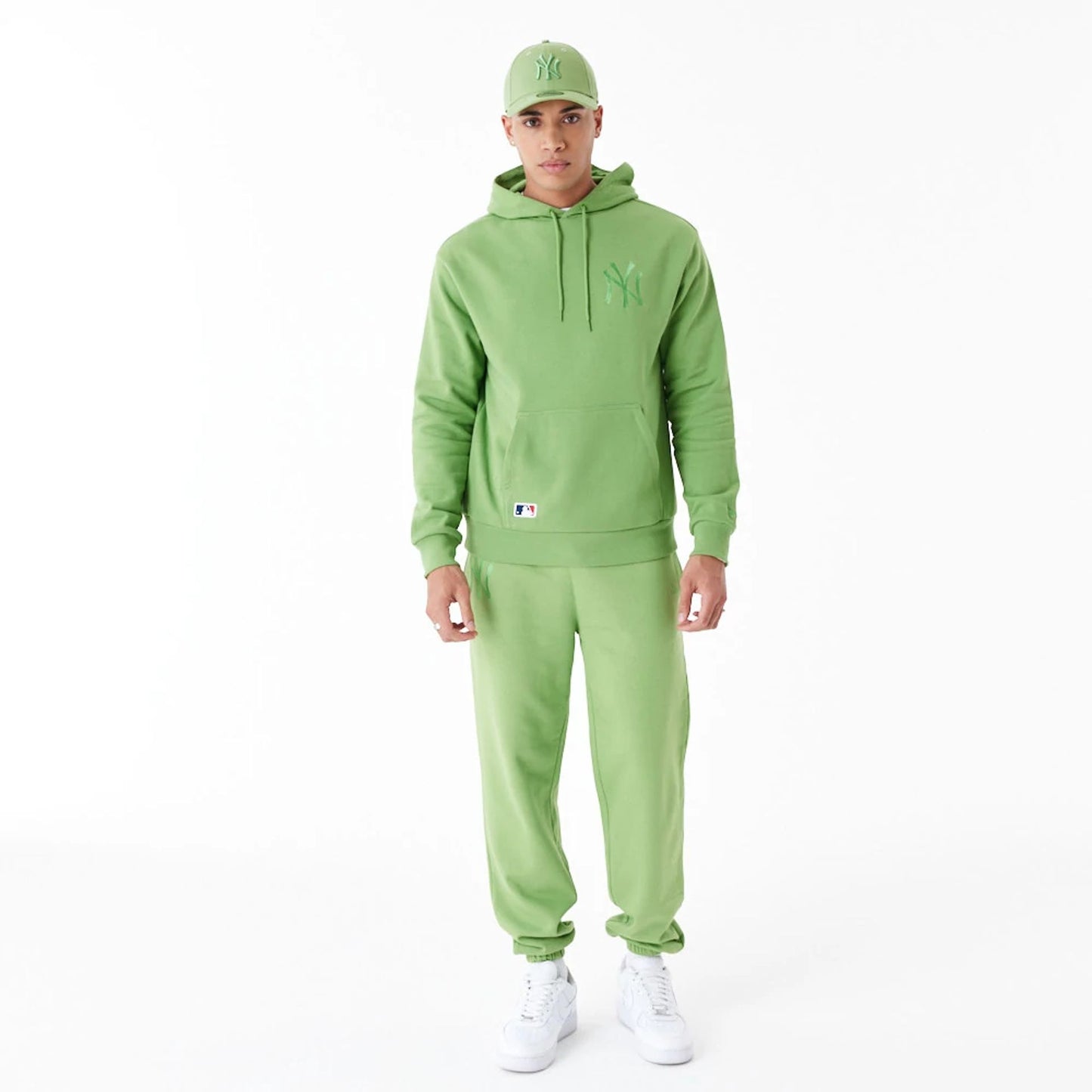 The Male model is wearing New York Yankees League Essential Green Oversized Pullover Hoodie 10