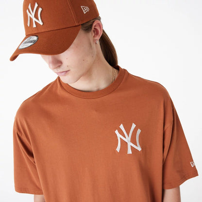 The Male model is wearing New York Yankees League Essential Brown Oversized T-Shirt 4