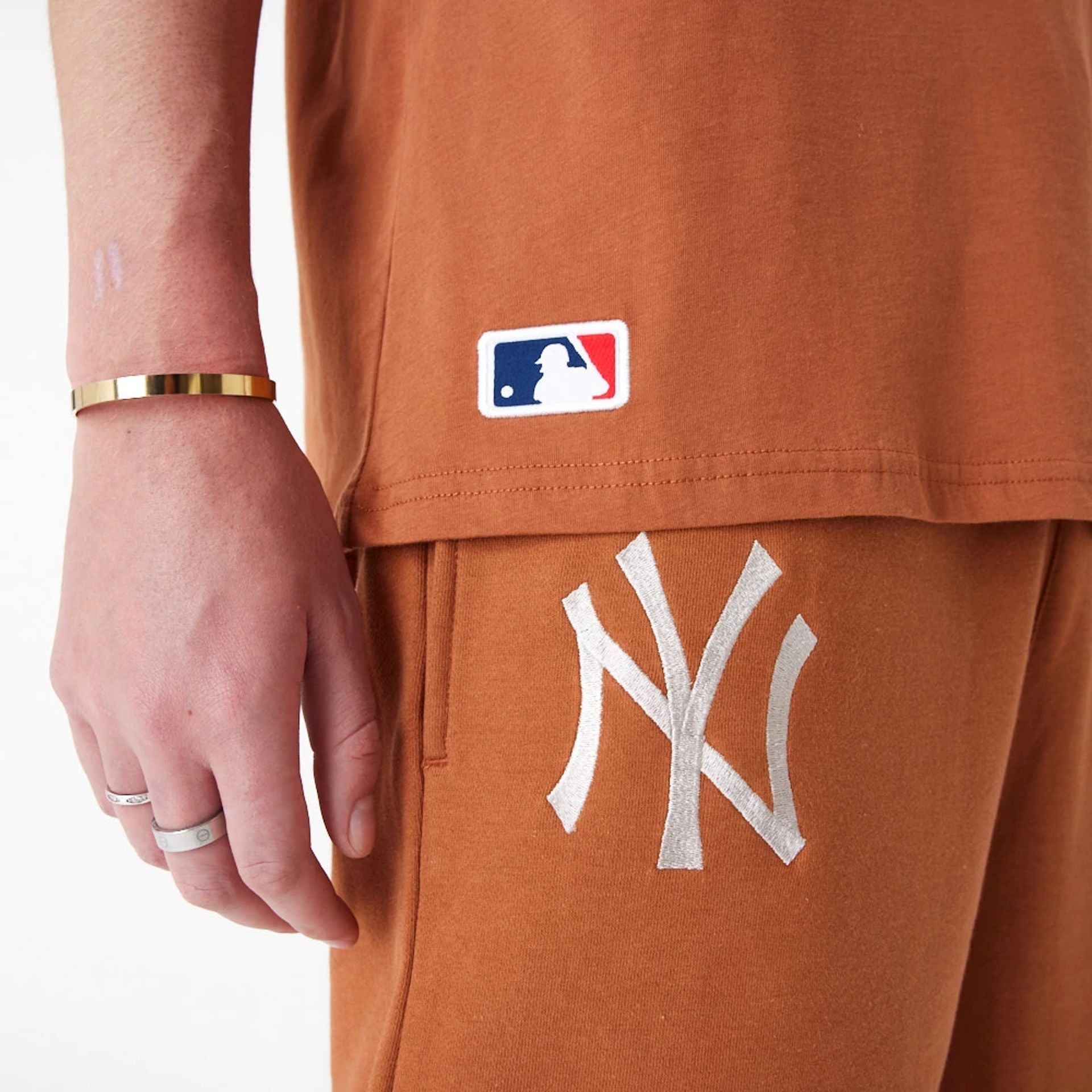 The Male model is wearing New York Yankees League Essential Brown Oversized T-Shirt 6