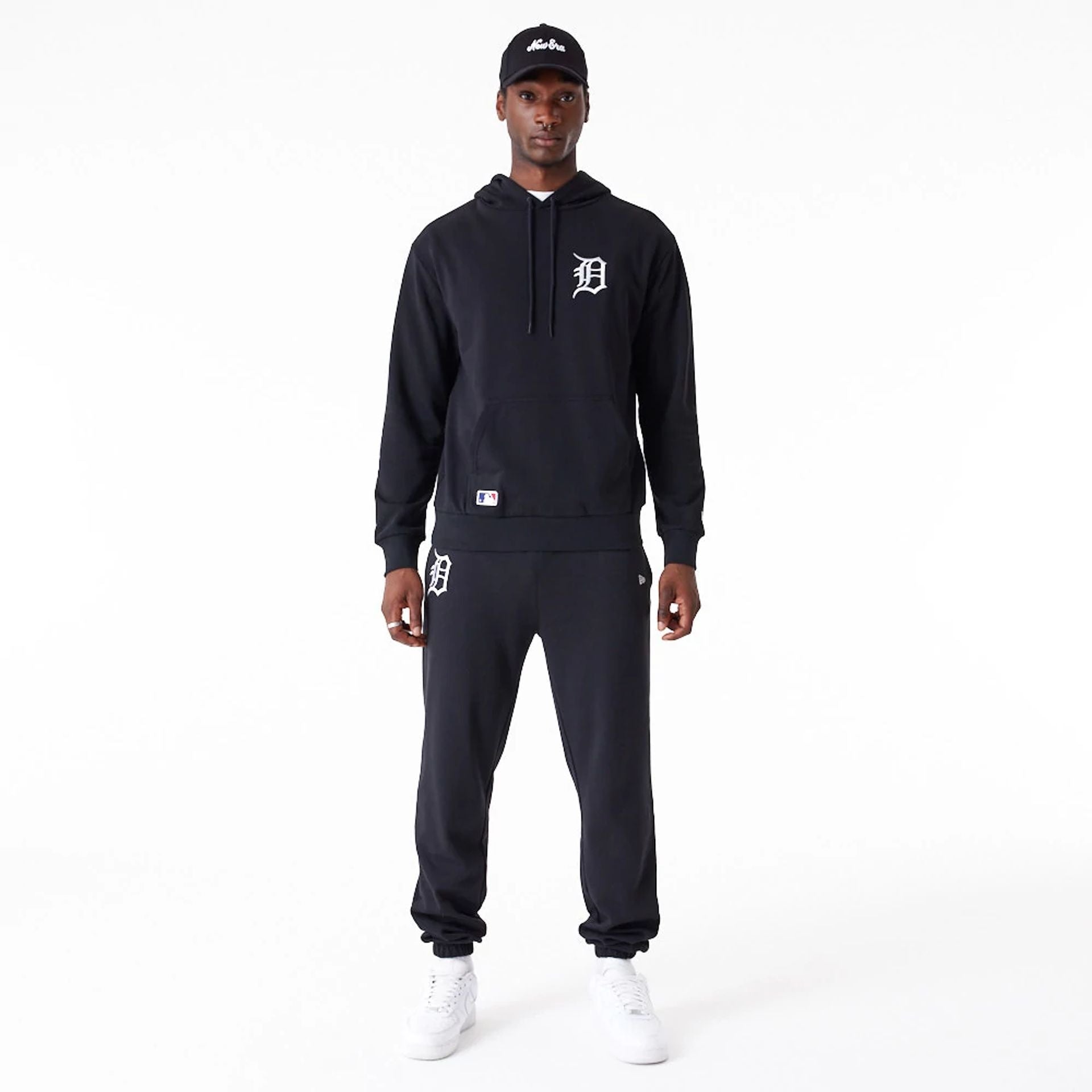 The Male model is wearing Detroit Tigers League Essential Black Oversized Pullover Hoodie 3