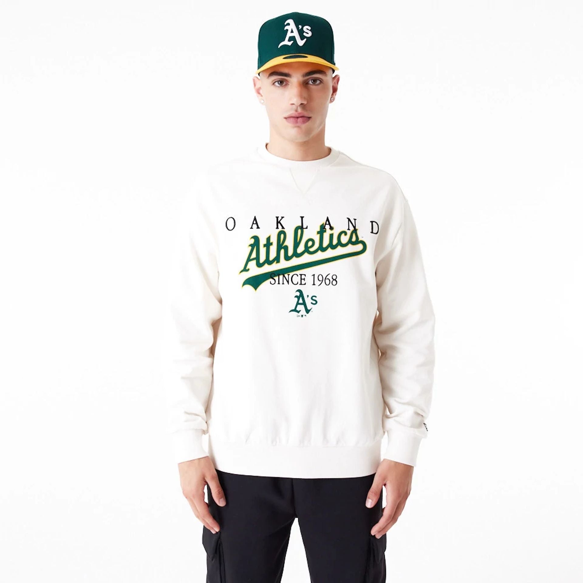 The Male model is wearing Oakland Athletics MLB Lifestyle Off White Crew Neck Sweatshirt 1