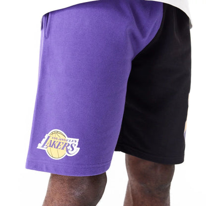 The Male model is wearing LA Lakers NBA Graphic Purple Shorts 5