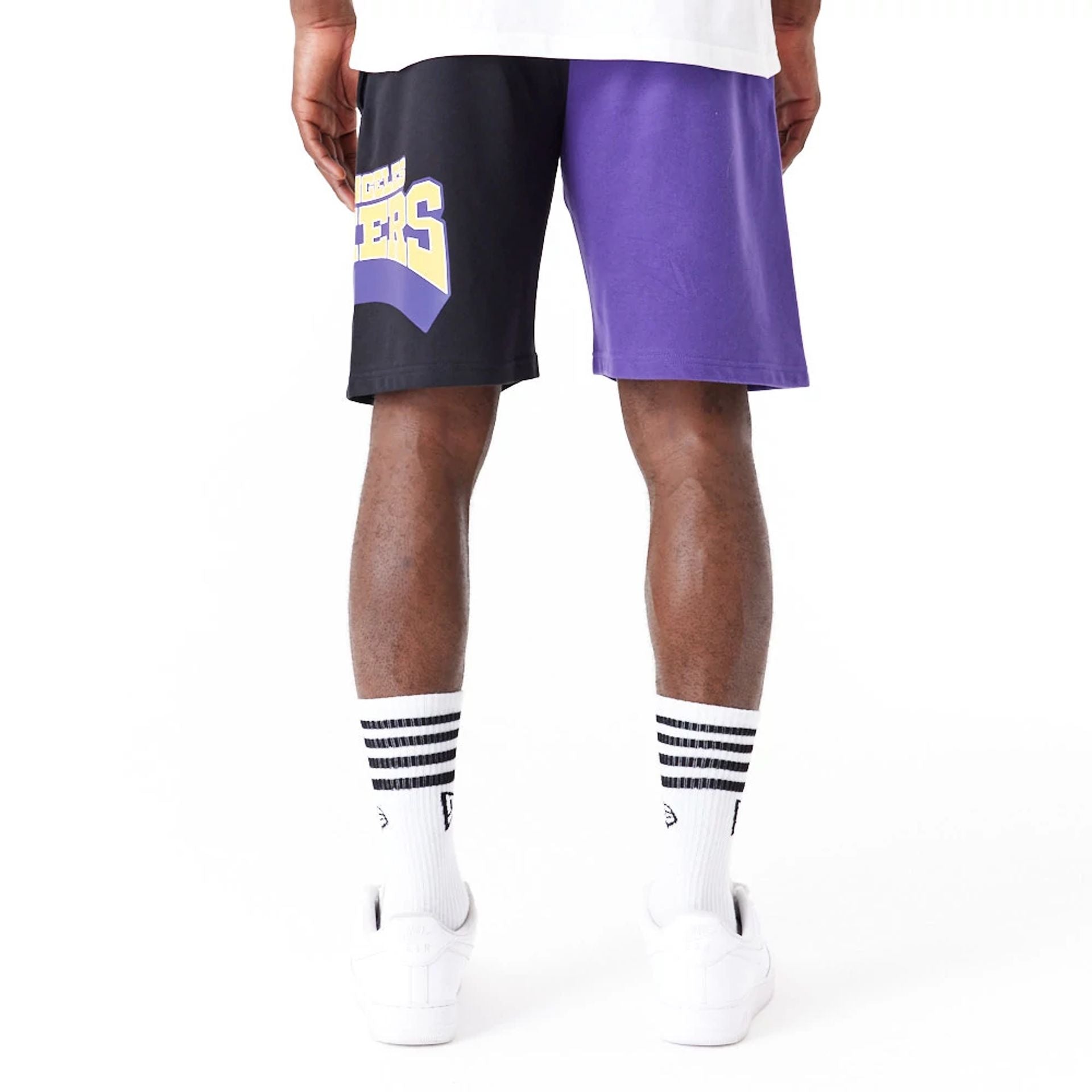 The Male model is wearing LA Lakers NBA Graphic Purple Shorts 8