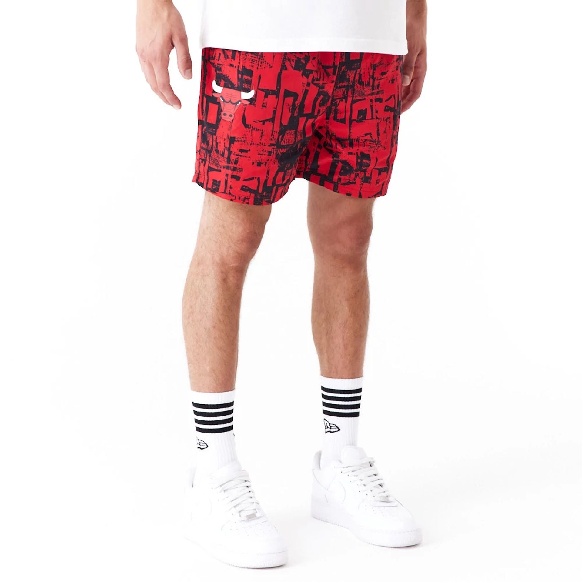 The Male model is wearing Chicago Bulls NBA All Over Print Red Shorts 1