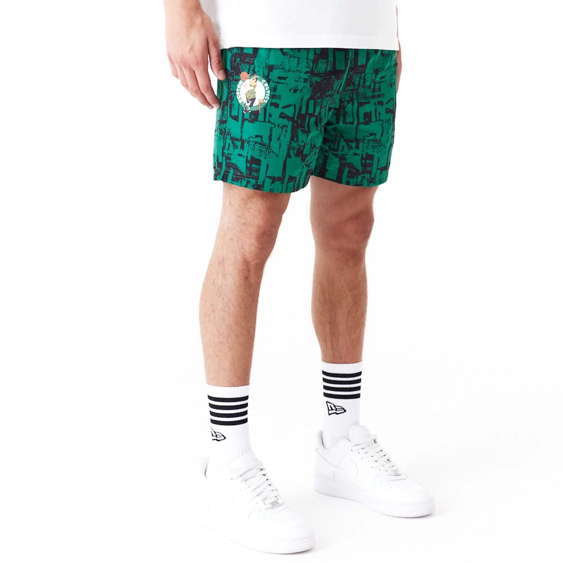 The Male model is wearing Boston Celtics NBA All Over Print Green Shorts 1