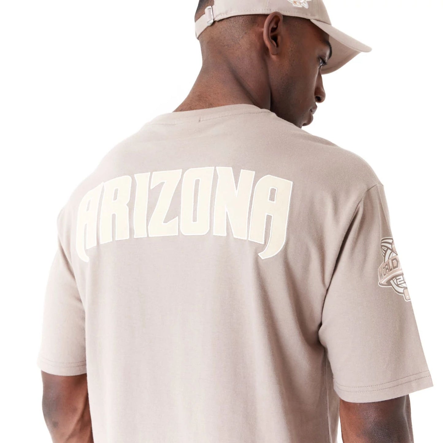 The Male model is wearing Arizona Diamondbacks World Series Pastel Brown Oversized T-Shirt 4