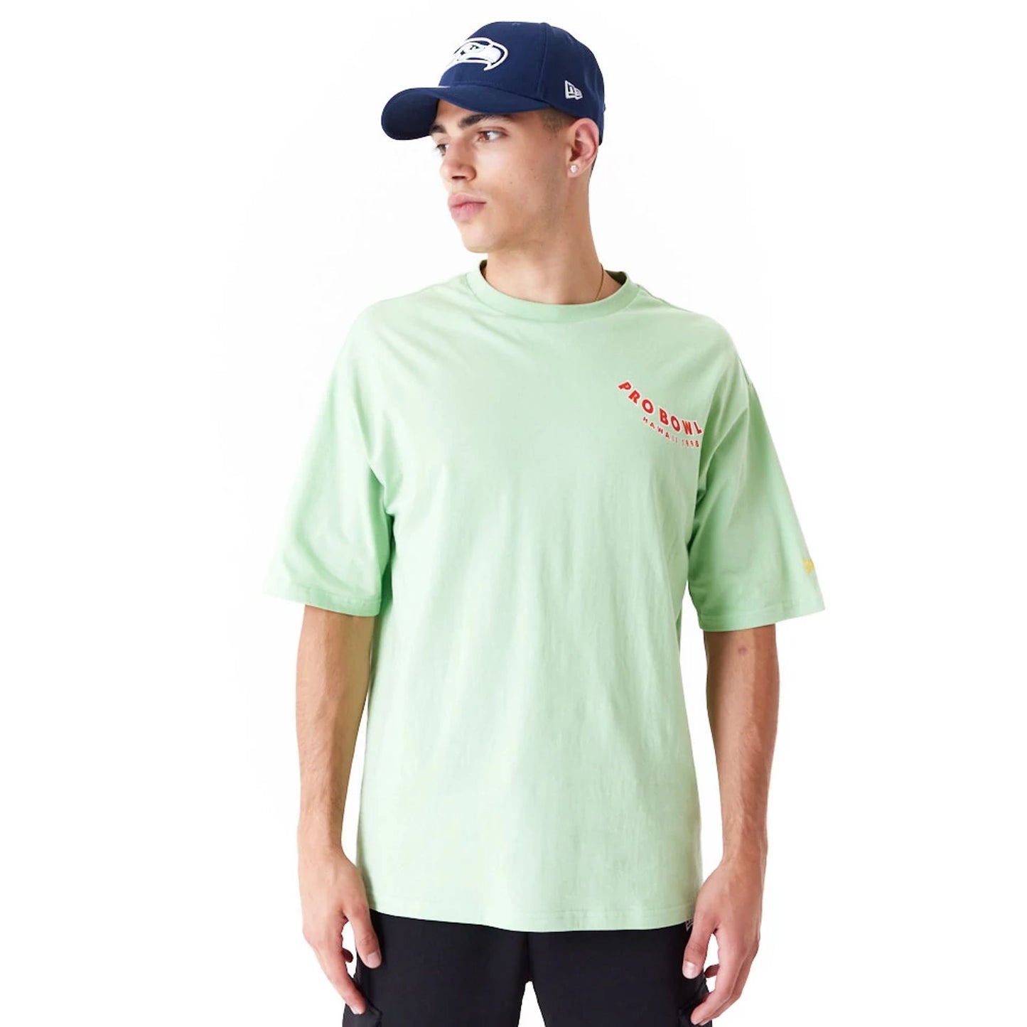 The Male model is wearing NFL Pro Bowl Hawaii NFC Graphic Bright Green Oversized T-Shirt 1