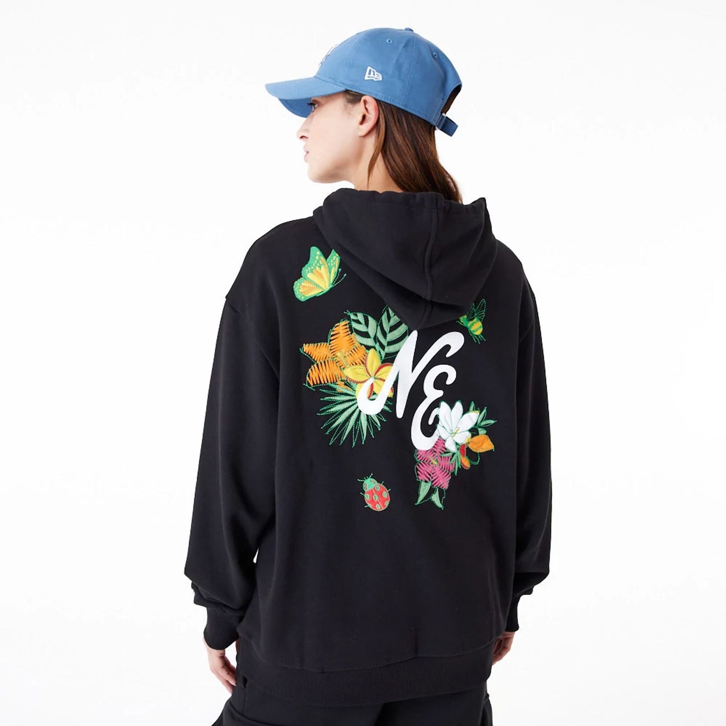 The Male model is wearing New Era Floral Graphic Black Oversized Pullover Hoodie 3