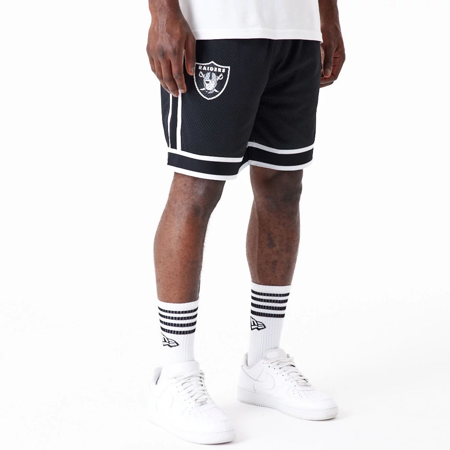 The Male model is wearing Las Vegas Raiders NFL Colour Block Black Shorts 1